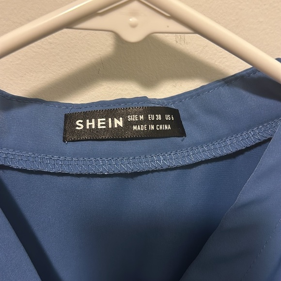 Blue button-down, v-neck blouse. - Picture 2 of 3